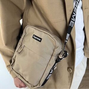 NWT Unisex Supreme Logo Strap Canvas Shoulder Bag In Sandy Tan 7” X 8.5” X 1.6”